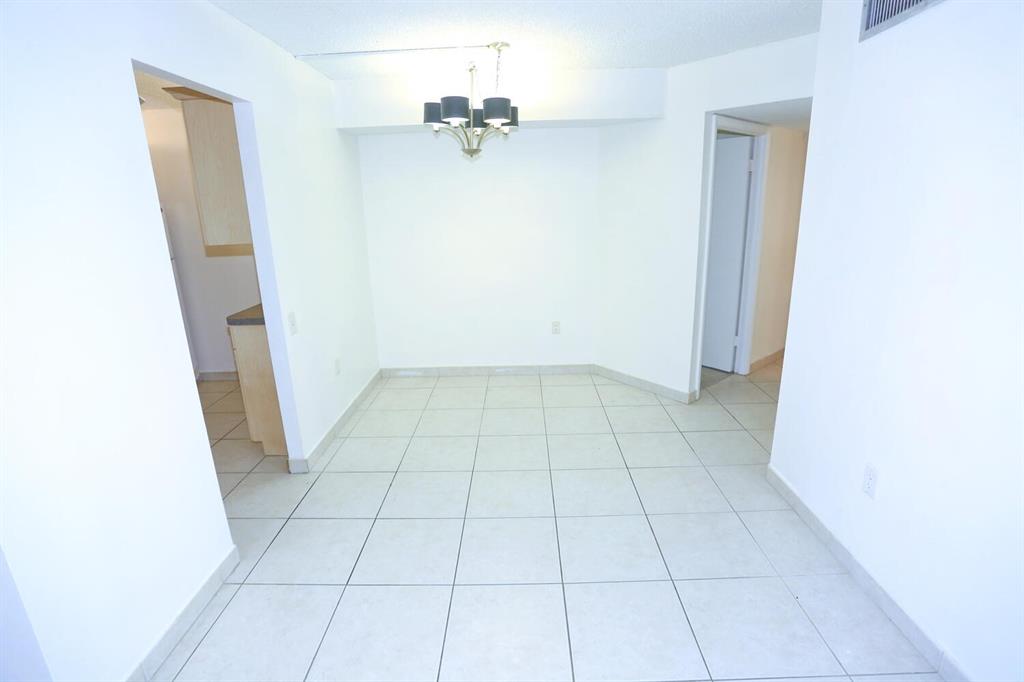 9151 Lime Bay Boulevard, Unit 310 Tamarac, FL 33321 - Photo 12 of 30 a view of an empty room