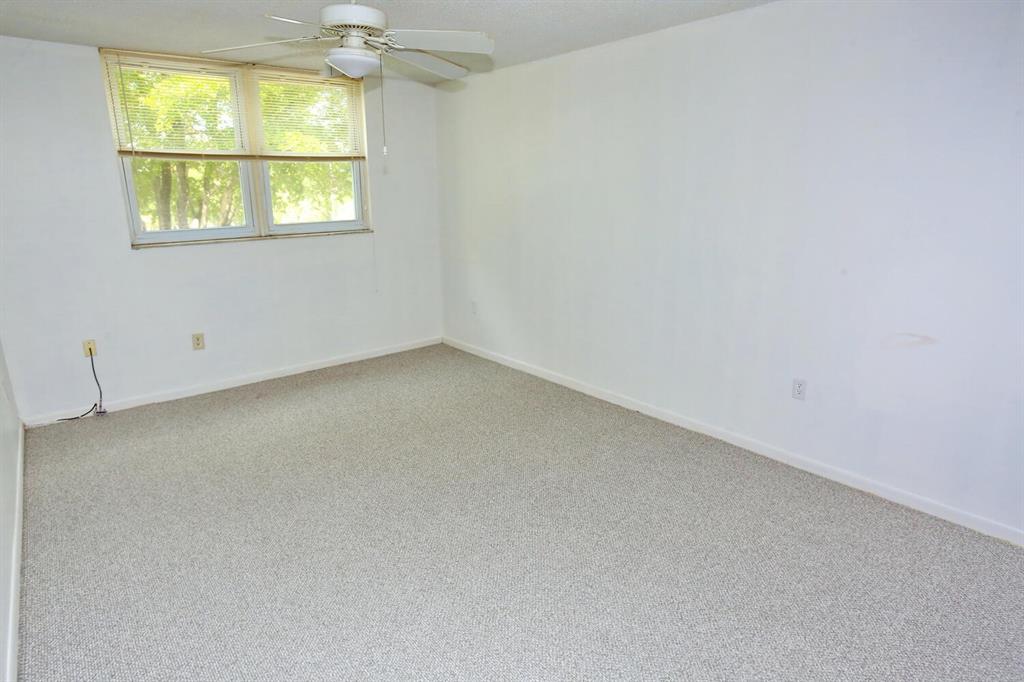 9151 Lime Bay Boulevard, Unit 310 Tamarac, FL 33321 - Photo 18 of 30 an empty room with a window