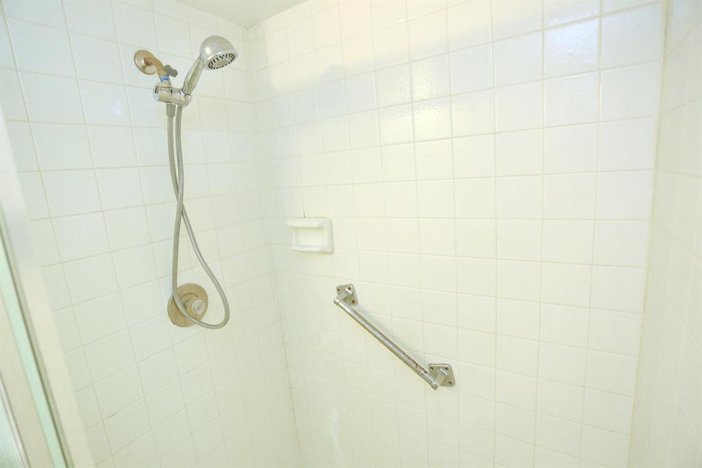 9151 Lime Bay Boulevard, Unit 310 Tamarac, FL 33321 - Photo 25 of 30 a bathroom with a shower