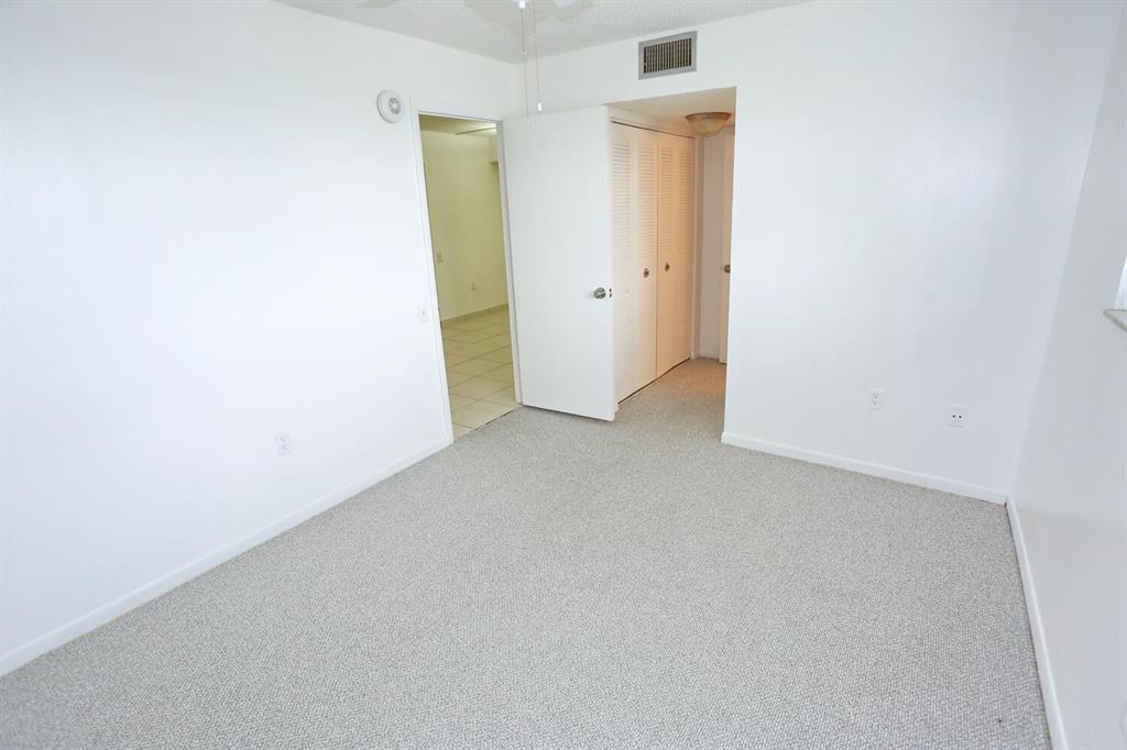 9151 Lime Bay Boulevard, Unit 310 Tamarac, FL 33321 - Photo 27 of 30 a view of an empty room