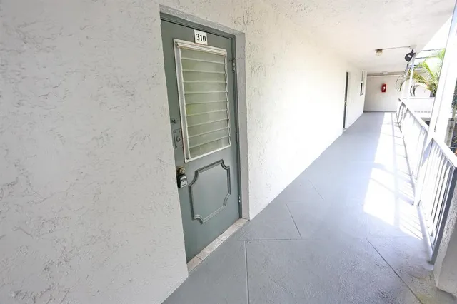 a view of an entryway with bathroom