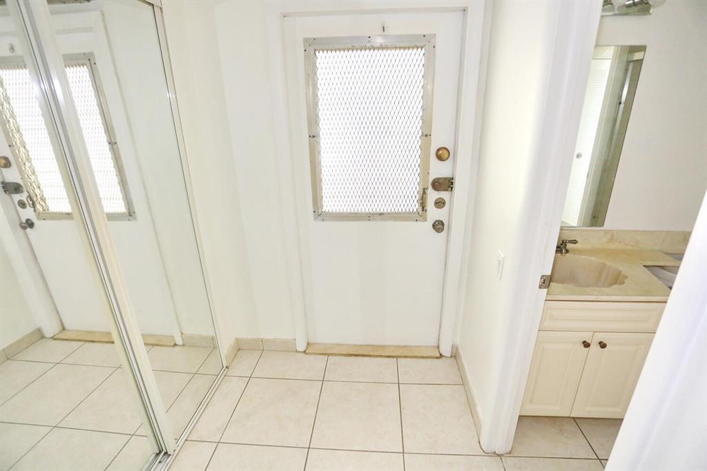 9151 Lime Bay Boulevard, Unit 310 Tamarac, FL 33321 - Photo 6 of 30 a view of an entryway with bathroom