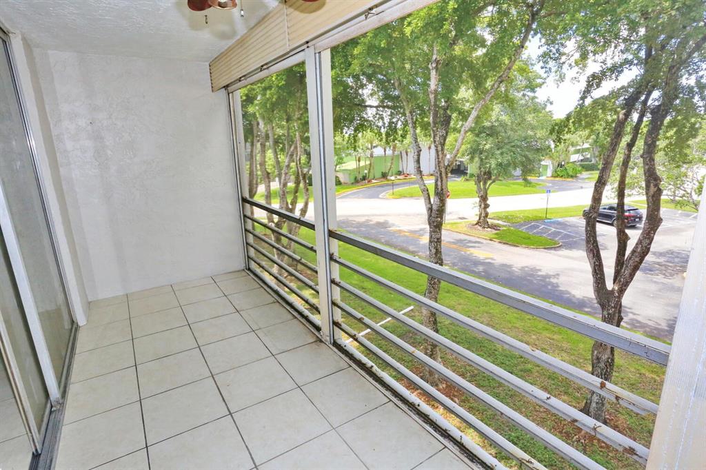 9151 Lime Bay Boulevard, Unit 310 Tamarac, FL 33321 - Photo 8 of 30 a view of an outdoor space