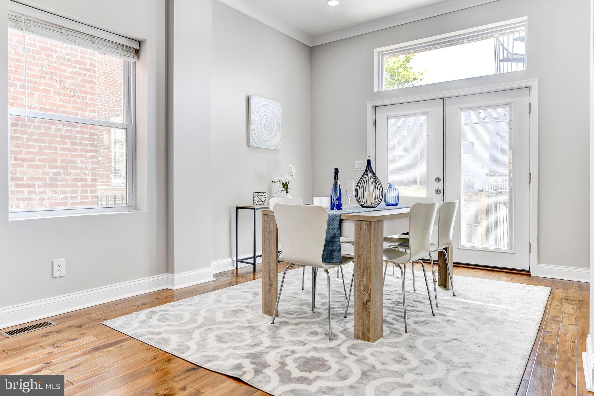 70 T Street Northwest, Unit 1 Washington, DC 20001 - Photo 12 of 37 Dining area with patio doors to rear deck