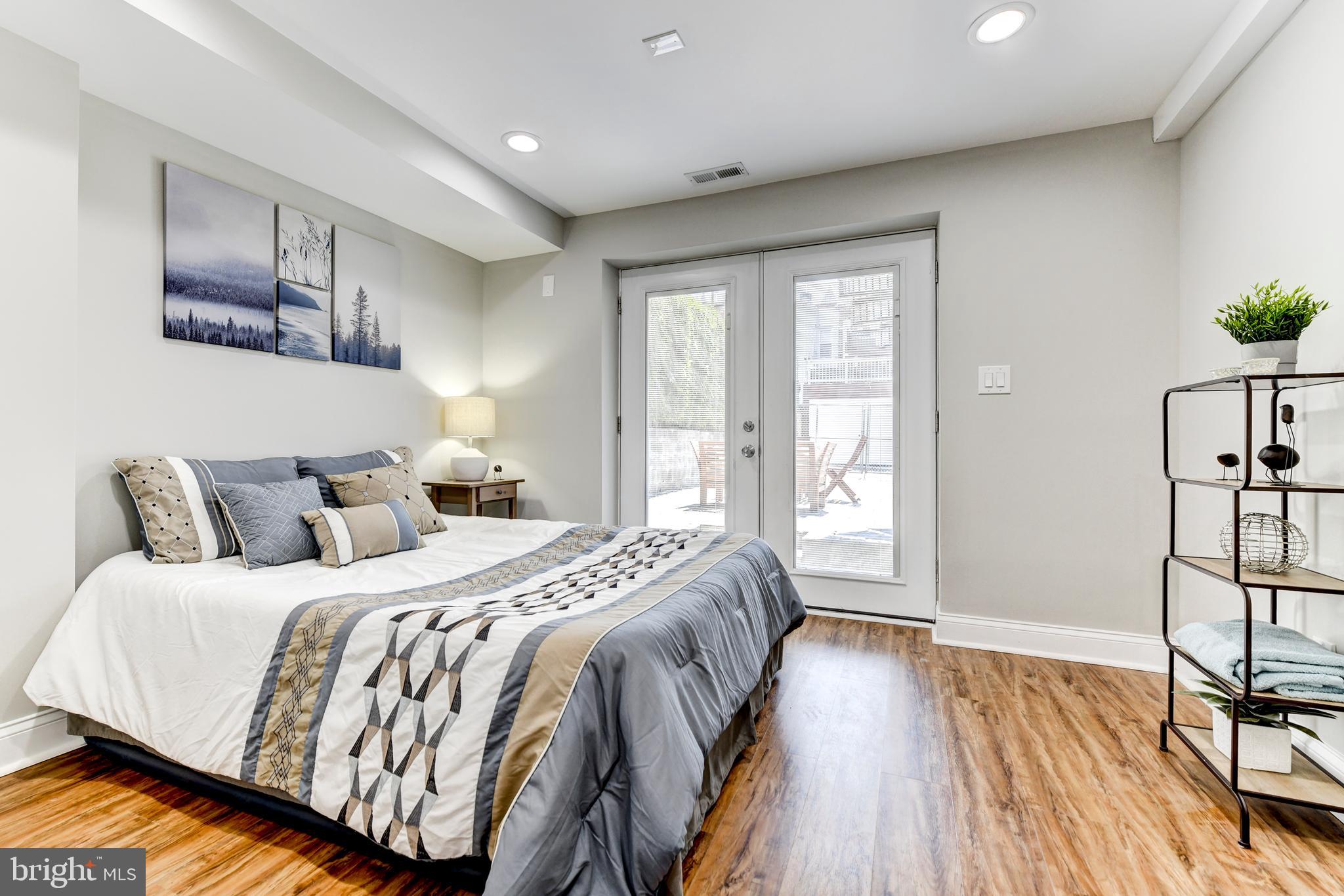 70 T Street Northwest, Unit 1 Washington, DC 20001 - Photo 17 of 37 Master bedroom with patio doors