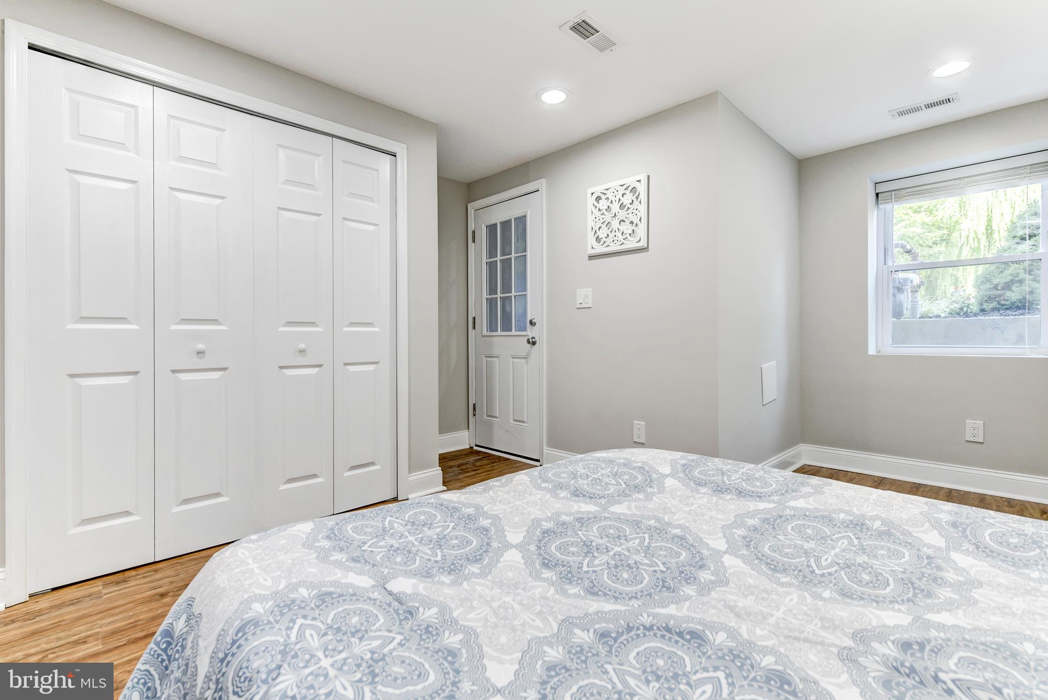 70 T Street Northwest, Unit 1 Washington, DC 20001 - Photo 23 of 37 Bedroom with large closet and door to the exterior