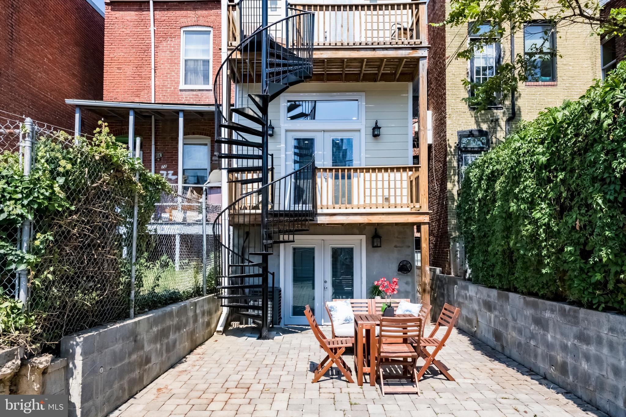 70 T Street Northwest, Unit 1 Washington, DC 20001 - Photo 27 of 37 Rear view with decks and modern staircase