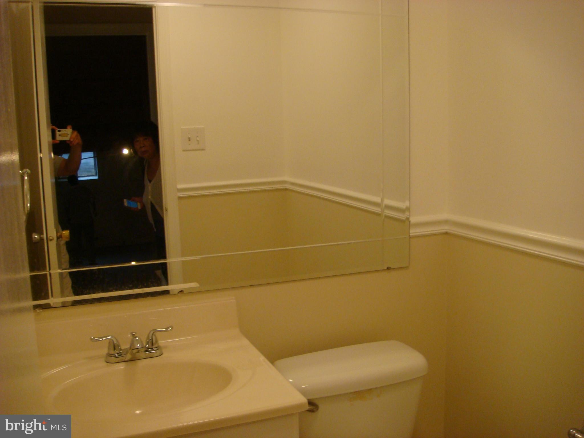 1 Tifton Court Potomac, MD 20854 - Photo 20 of 24 a bathroom with a sink a toilet and shower