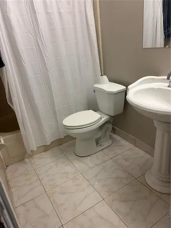 a bathroom with a toilet and a sink