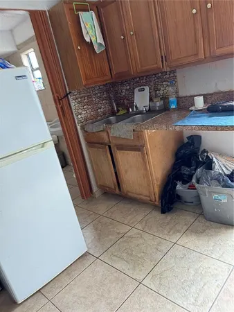 a kitchen with stainless steel appliances a stove a microwave and a cabinets