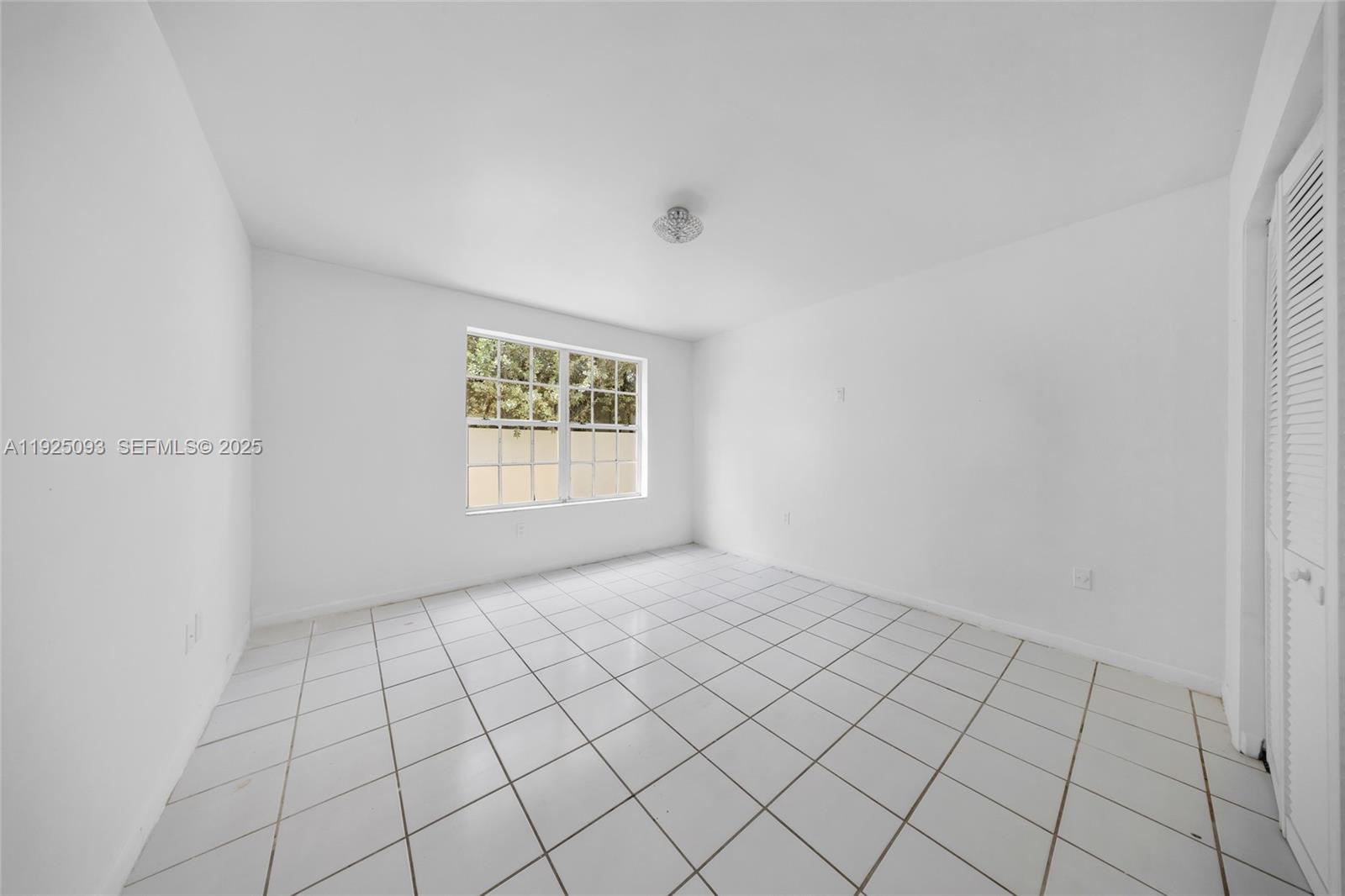 3453 Southwest 23rd Terrace, Unit 1 Miami, FL 33145 - Photo 11 of 22 a view of an empty room and window