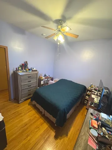 a bedroom with a bed and cabinets