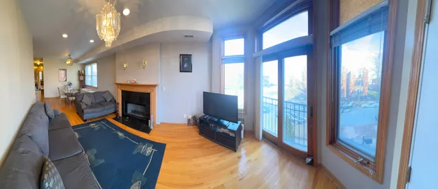 a living room with furniture fireplace and flat screen tv