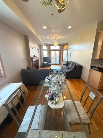 a living room with furniture and painting on the wall