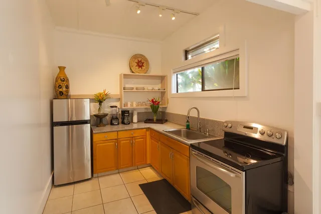 a kitchen with a sink appliances and cabinets