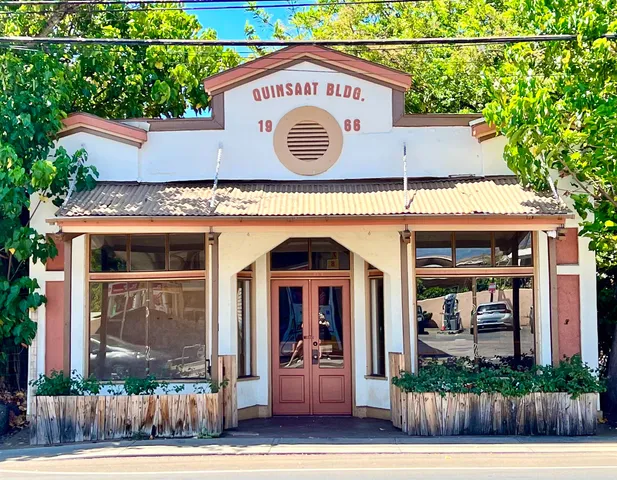 a front view of a building with garden