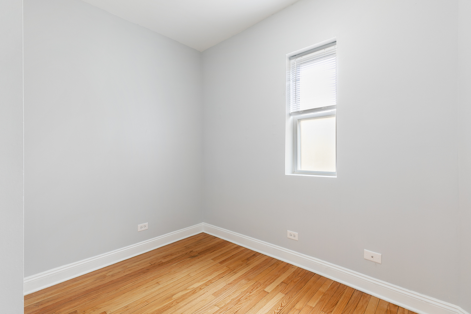 2005 West Jarvis Avenue, Unit 3 Chicago, IL 60645 - Photo 12 of 18 a view of empty room with wooden floor