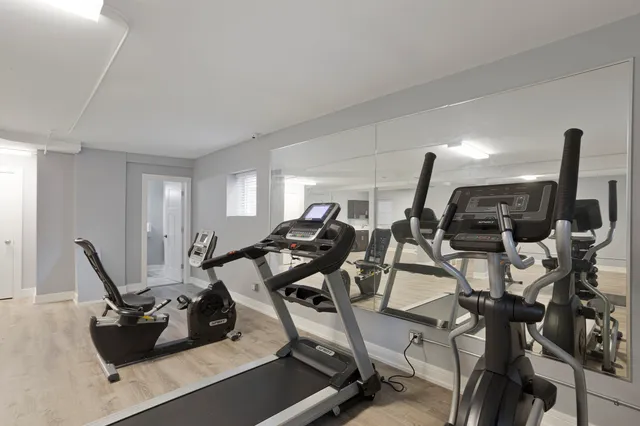 a room with gym equipment and window