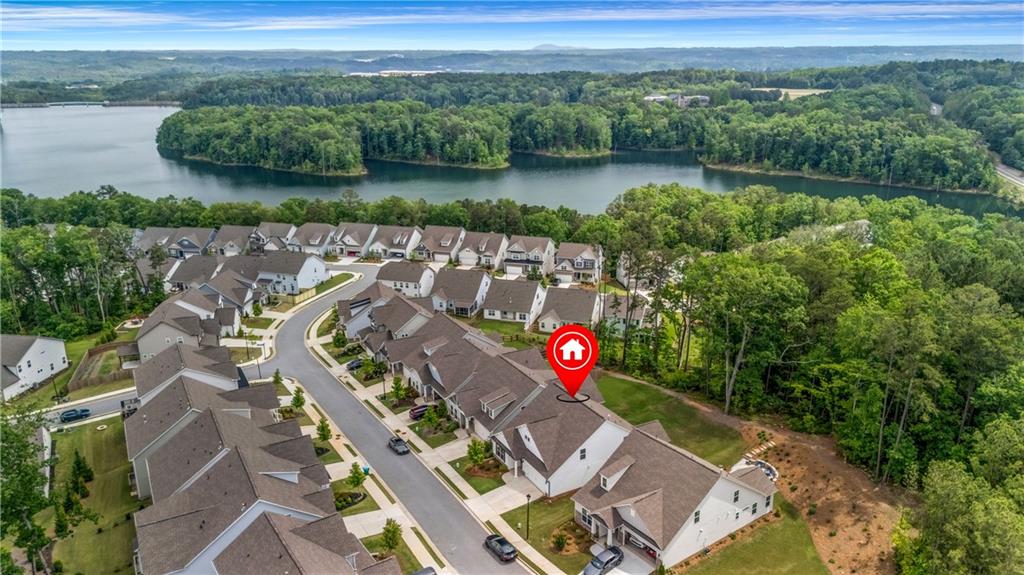 an aerial view of a house with a lake view