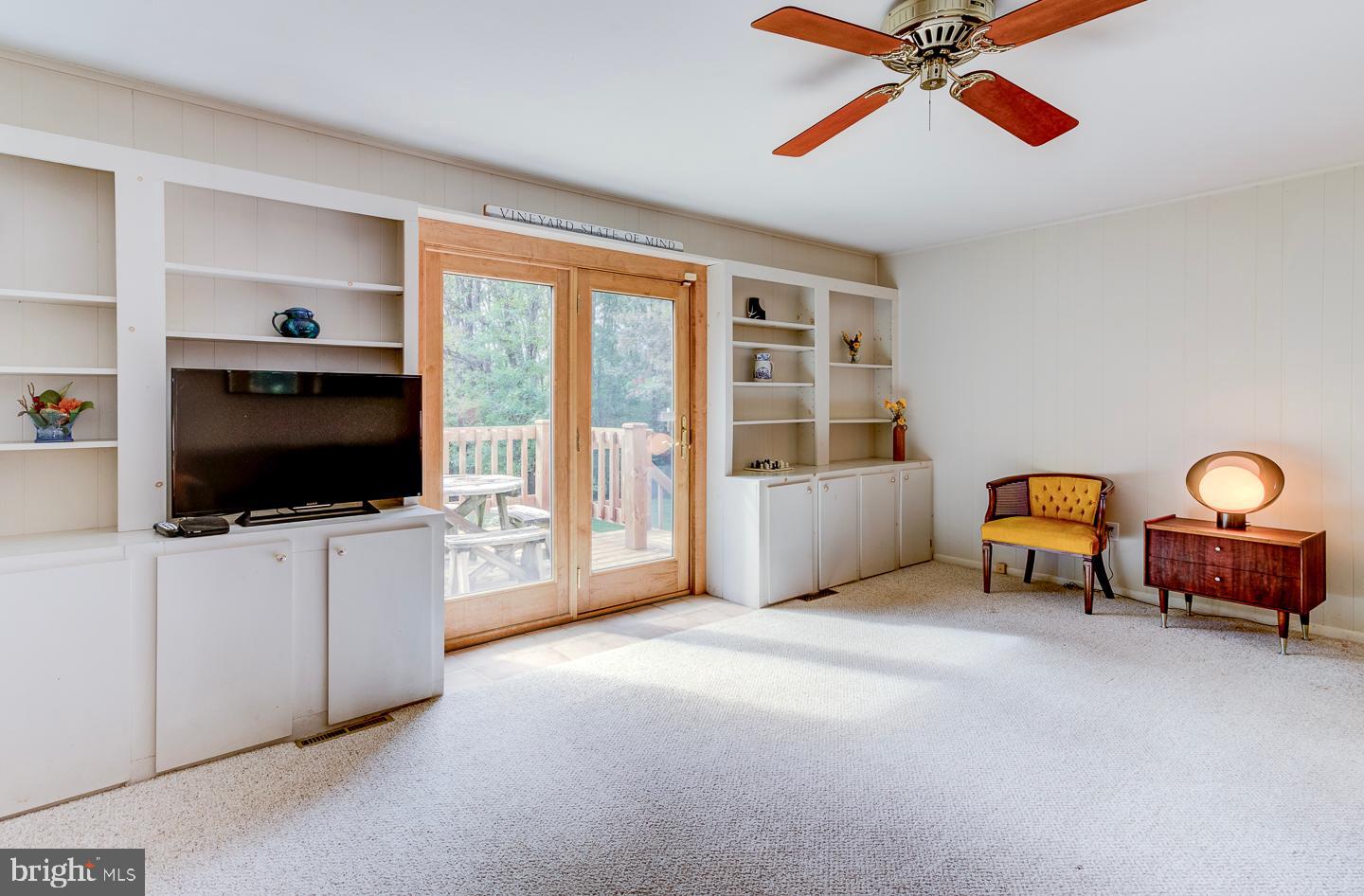 469 Dean Drive Kennett Square, PA 19348 - Photo 24 of 47 a living room with furniture and a flat screen tv