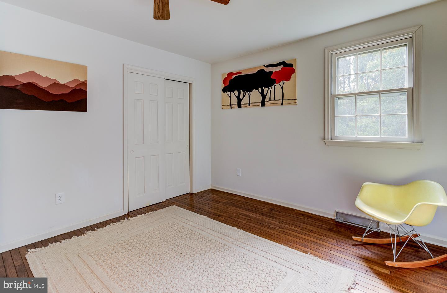 469 Dean Drive Kennett Square, PA 19348 - Photo 36 of 47 a bedroom with a bed and a chandelier