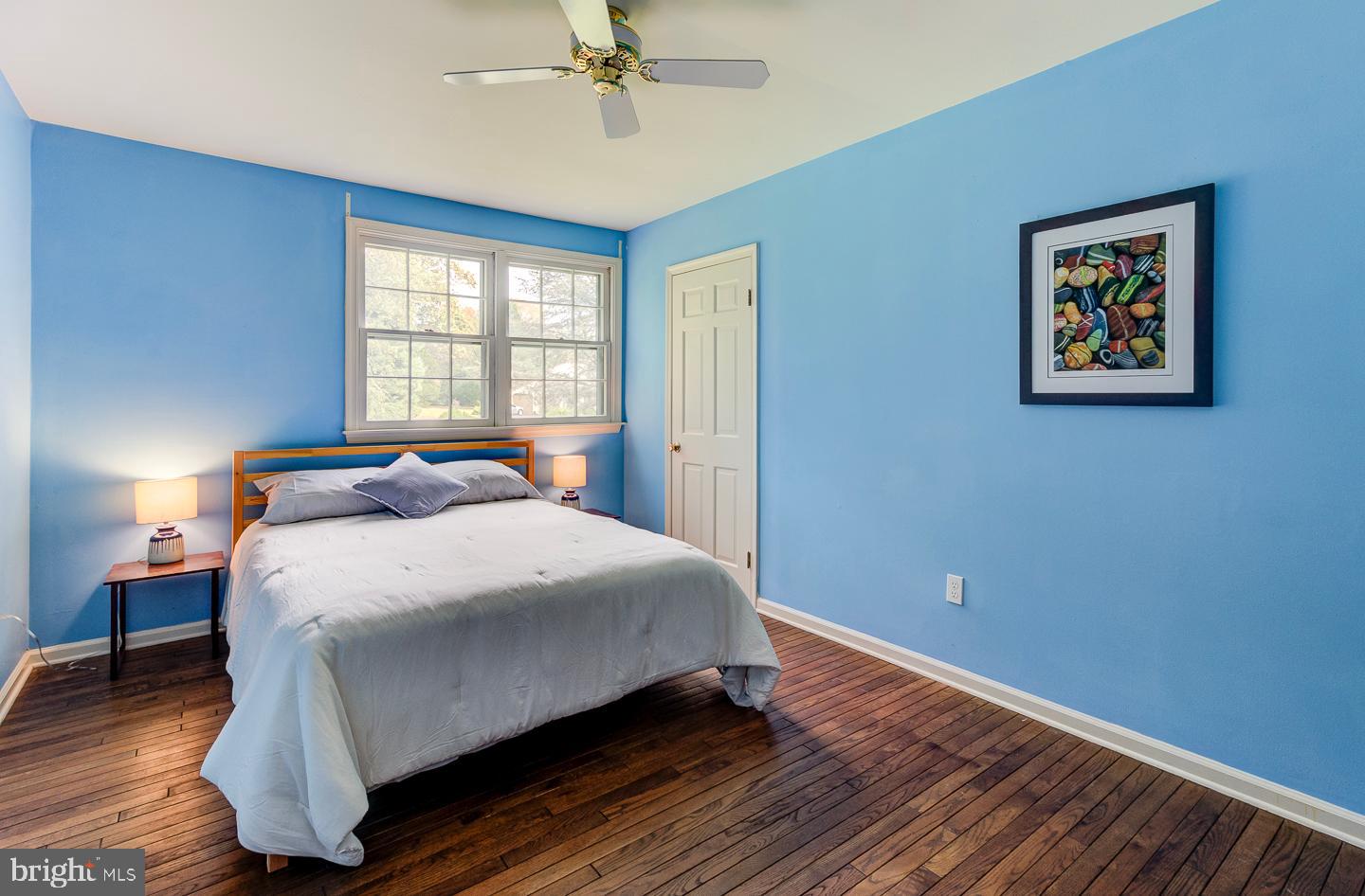 469 Dean Drive Kennett Square, PA 19348 - Photo 37 of 47 a bedroom with a bed and wooden floor