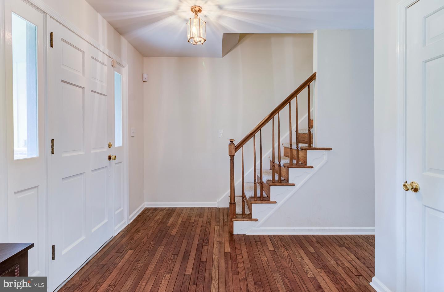 469 Dean Drive Kennett Square, PA 19348 - Photo 6 of 47 a view of entryway and hall with wooden floor