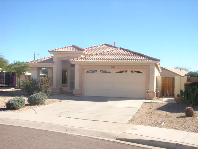 a front view of a house with a garage