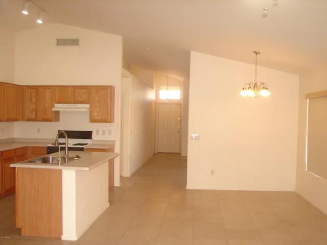 a view of a kitchen with a sink