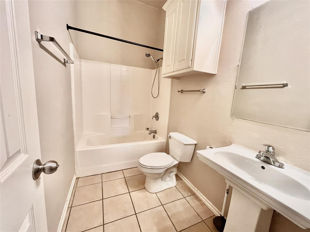 4808 Heber Springs Trail Fort Worth, TX 76244 - Photo 13 of 16 a bathroom with a sink a toilet and shower