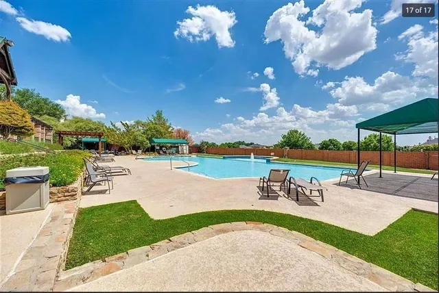 a view of a backyard with sitting area