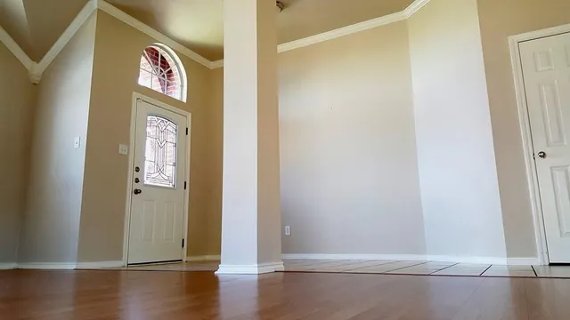 a view of an entryway with wooden floor