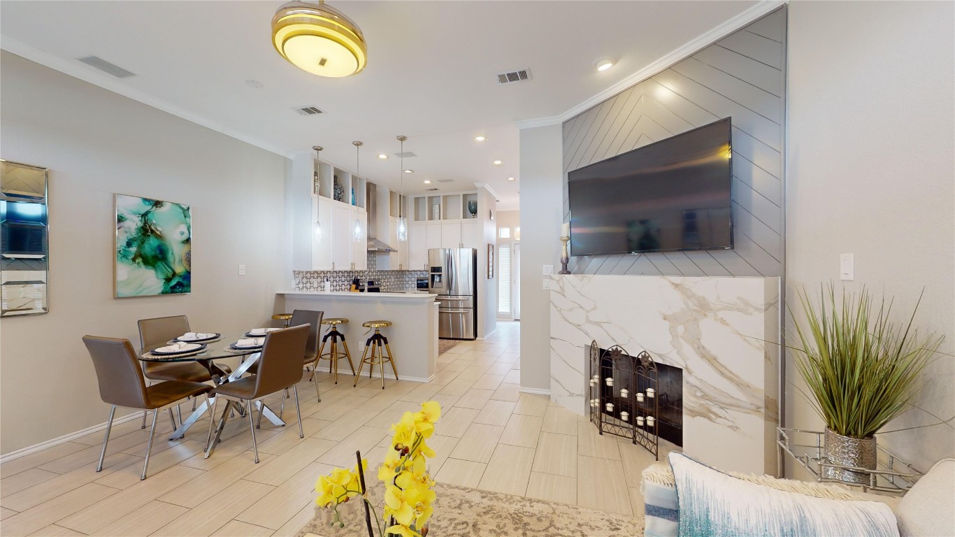 Dining space featuring ornamental molding and recessed lighting