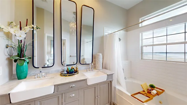 a bathroom with a double vanity sink and a mirror