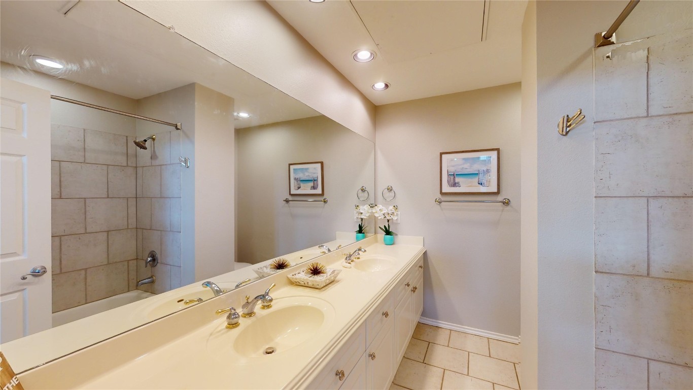 2918 Ranch Road 620, Unit 297 Austin, TX 78734 - Photo 15 of 37 Full bathroom with double vanity, tile patterned floors, shower / bathtub combination, and recessed lighting