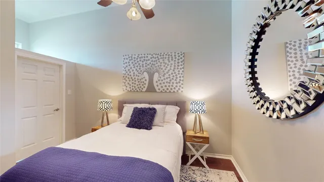 a bedroom with a bed and a window