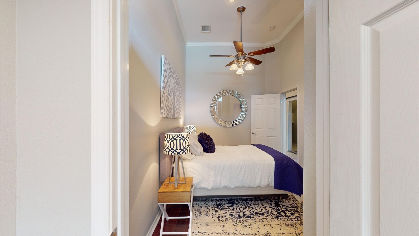 2918 Ranch Road 620, Unit 297 Austin, TX 78734 - Photo 19 of 37 Bedroom with crown molding and baseboards