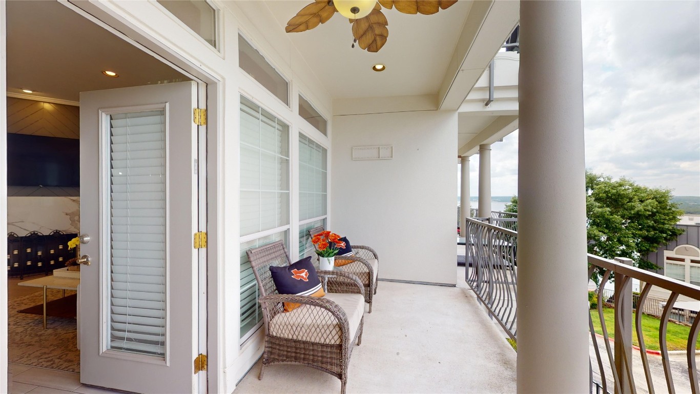2918 Ranch Road 620, Unit 297 Austin, TX 78734 - Photo 2 of 37 Balcony featuring a ceiling fan