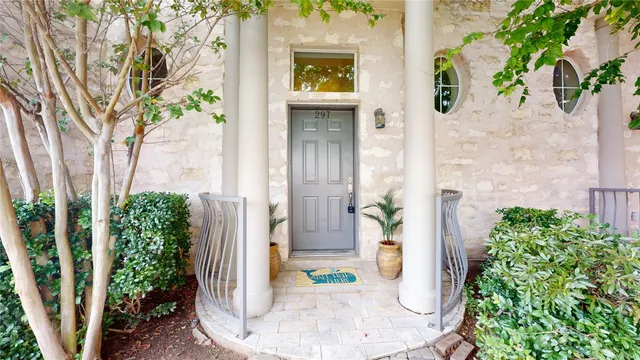 a view of a entryway with flower plants