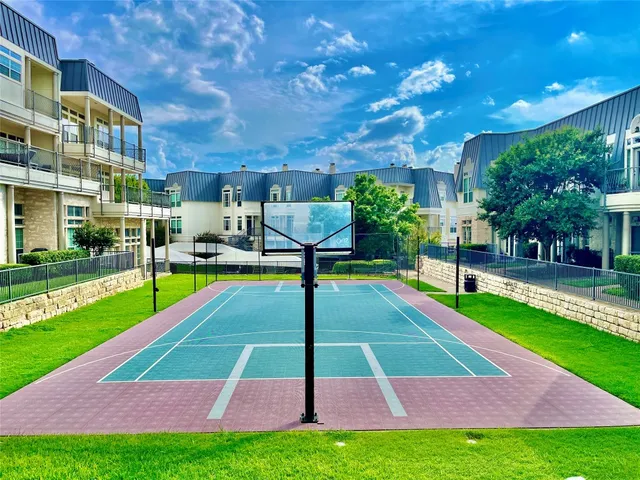 a view of yard with swimming pool and green space