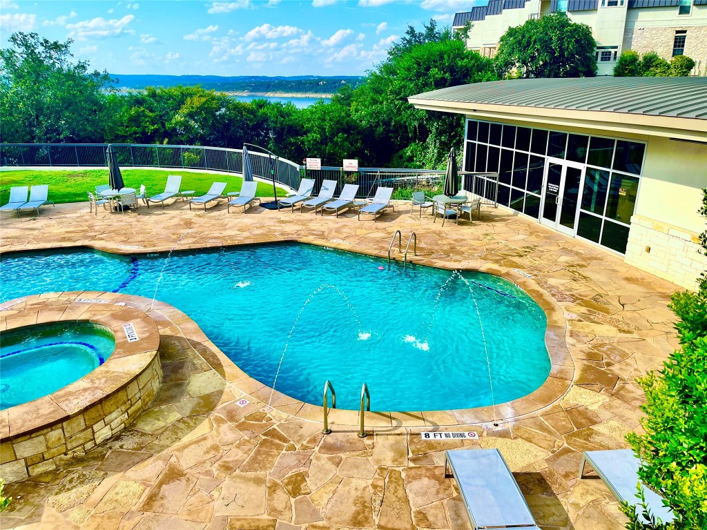 2918 Ranch Road 620, Unit 297 Austin, TX 78734 - Photo 32 of 37 Community pool featuring a patio area and a hot tub