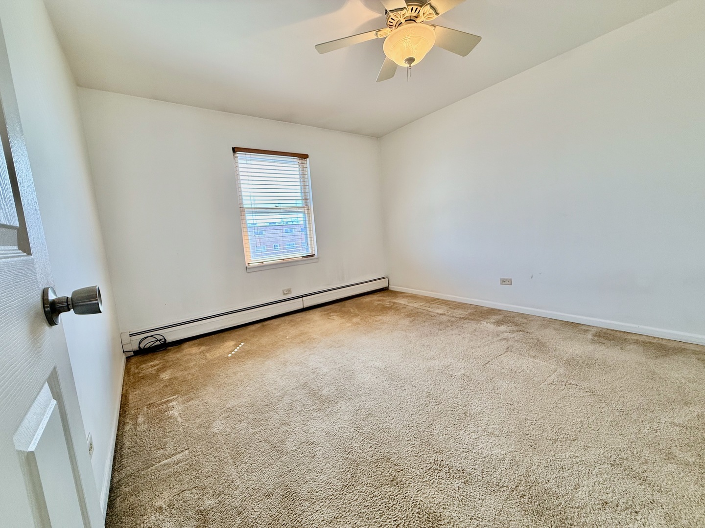 3823 West 123rd Street, Unit 302 Alsip, IL 60803 - Photo 20 of 40 an empty room with a window