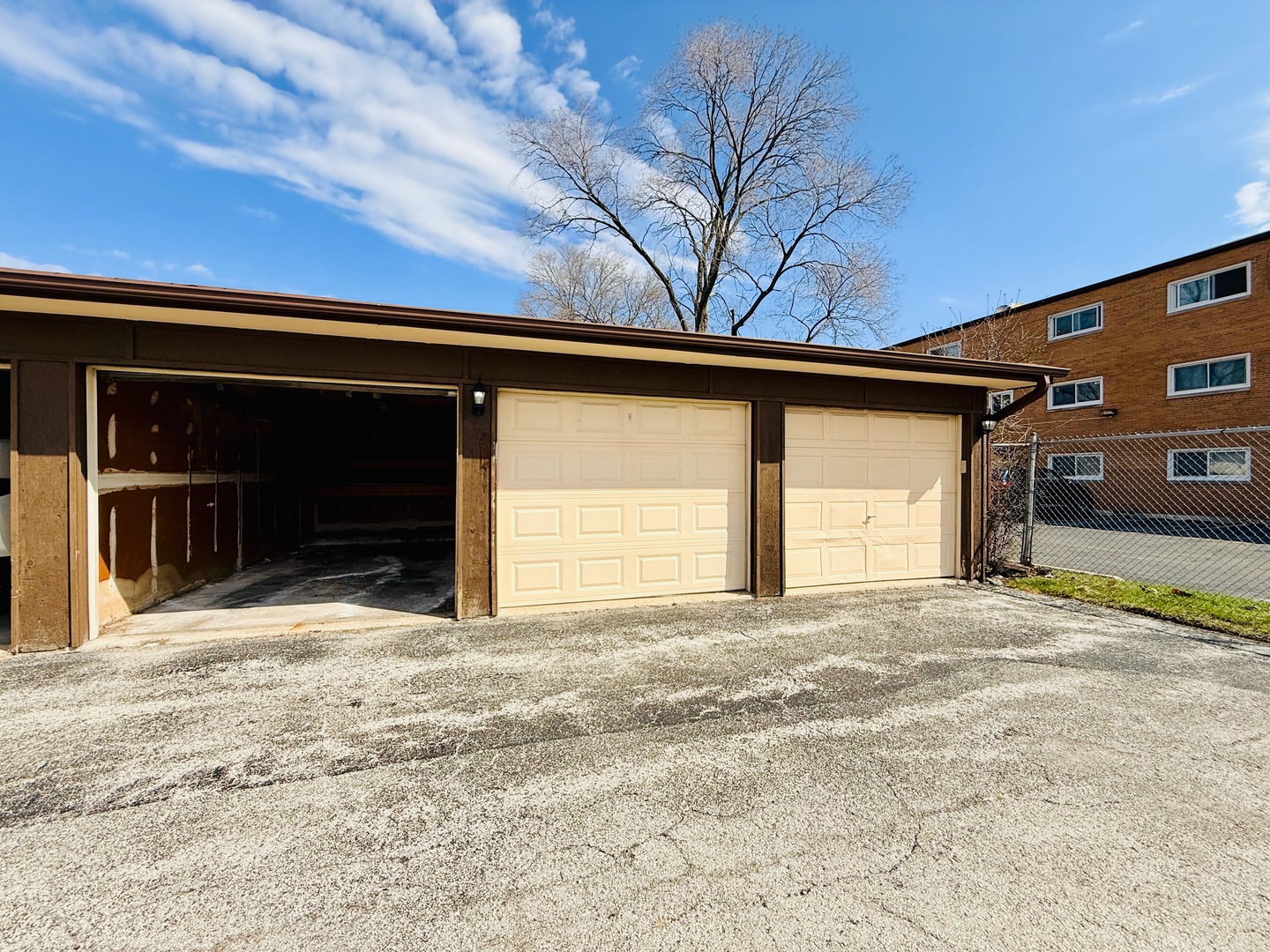 3823 West 123rd Street, Unit 302 Alsip, IL 60803 - Photo 30 of 40 a view of garage with a large tree