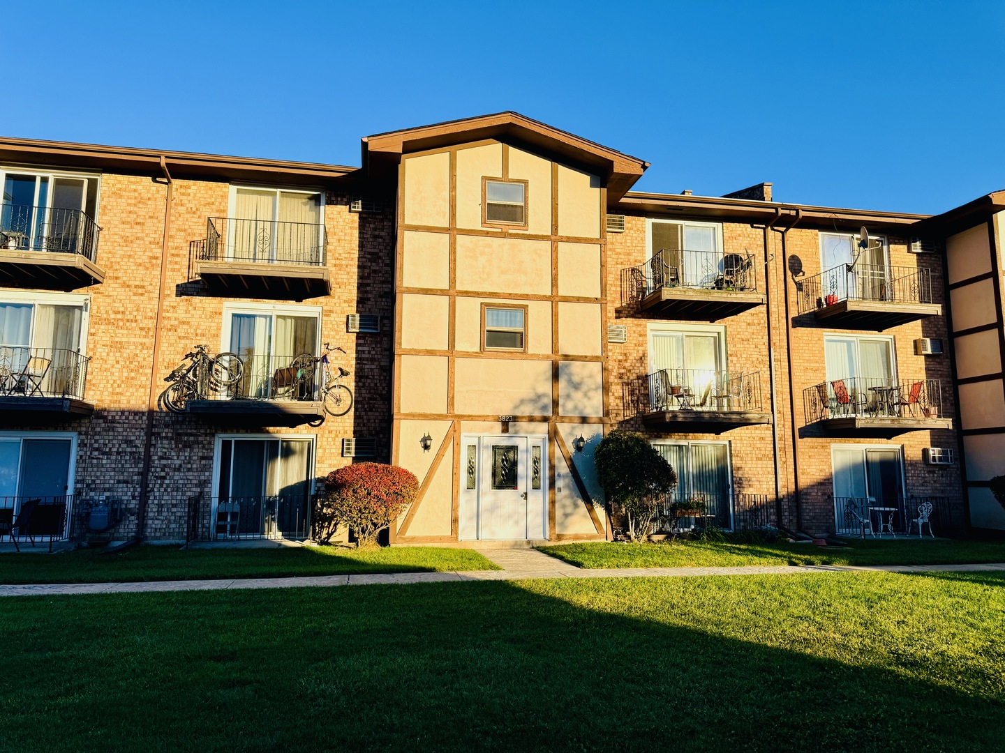 3823 West 123rd Street, Unit 302 Alsip, IL 60803 - Photo 3 of 40 a front view of a house with a yard