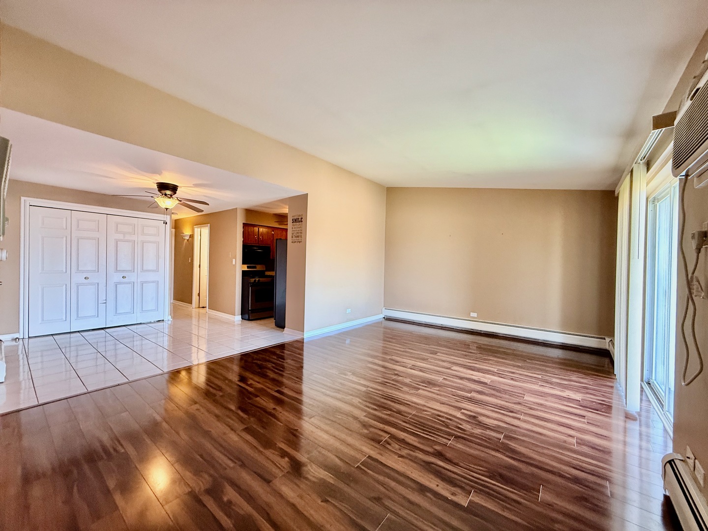 3823 West 123rd Street, Unit 302 Alsip, IL 60803 - Photo 7 of 40 a view of an empty room with wooden floor