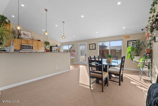 552 Spur Court Fernley, NV 89408 - Photo 13 of 46 a dining area with furniture and a view of kitchen