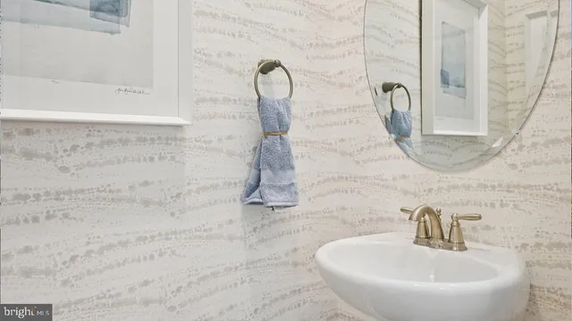 a bathroom with a granite countertop shower and a sink
