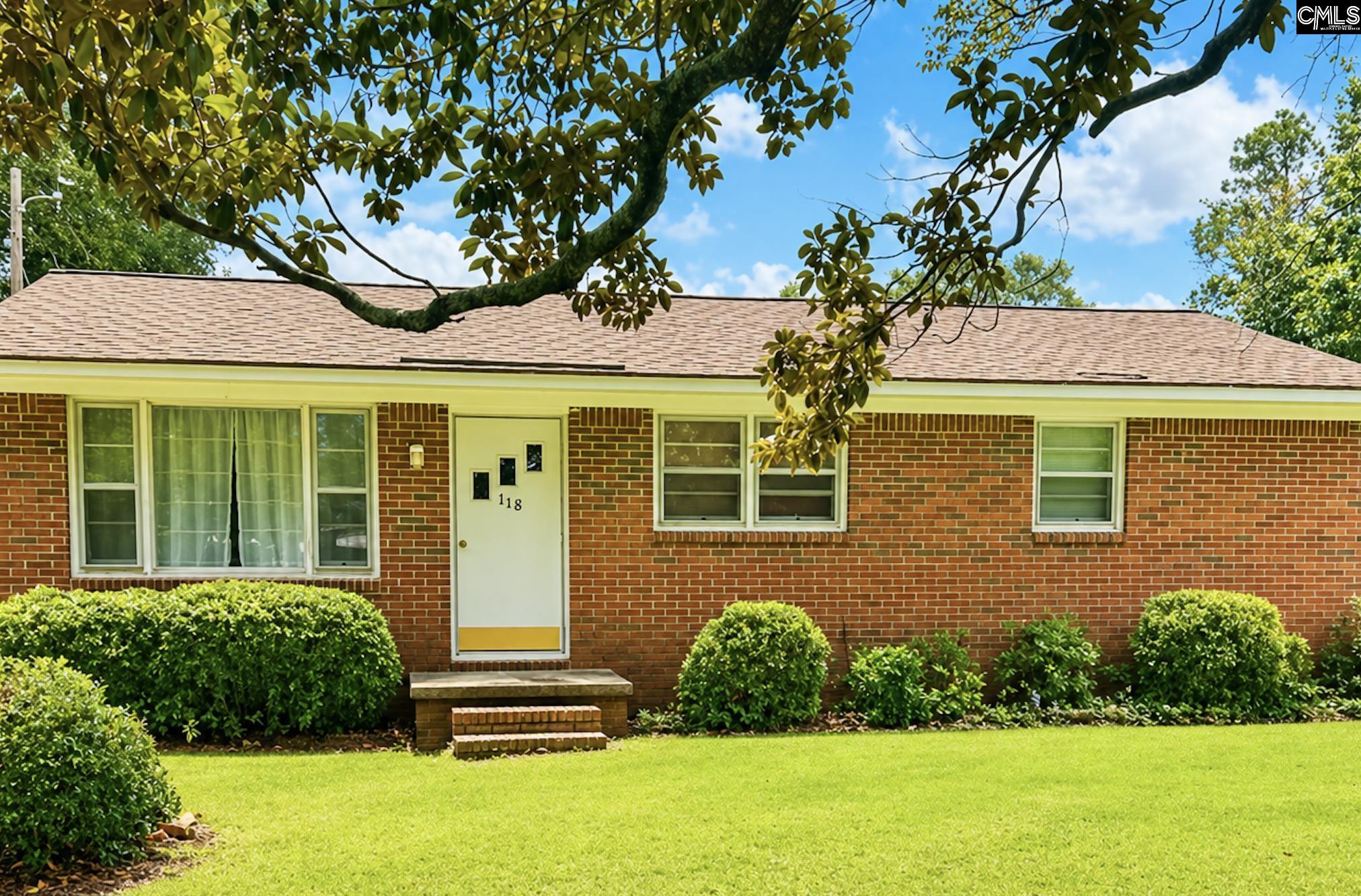 118 State Rd S-38-1224 Cordova, SC 29039 - Photo 1 of 12 a front view of a house with a yard