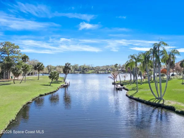 a view of a lake with a big yard