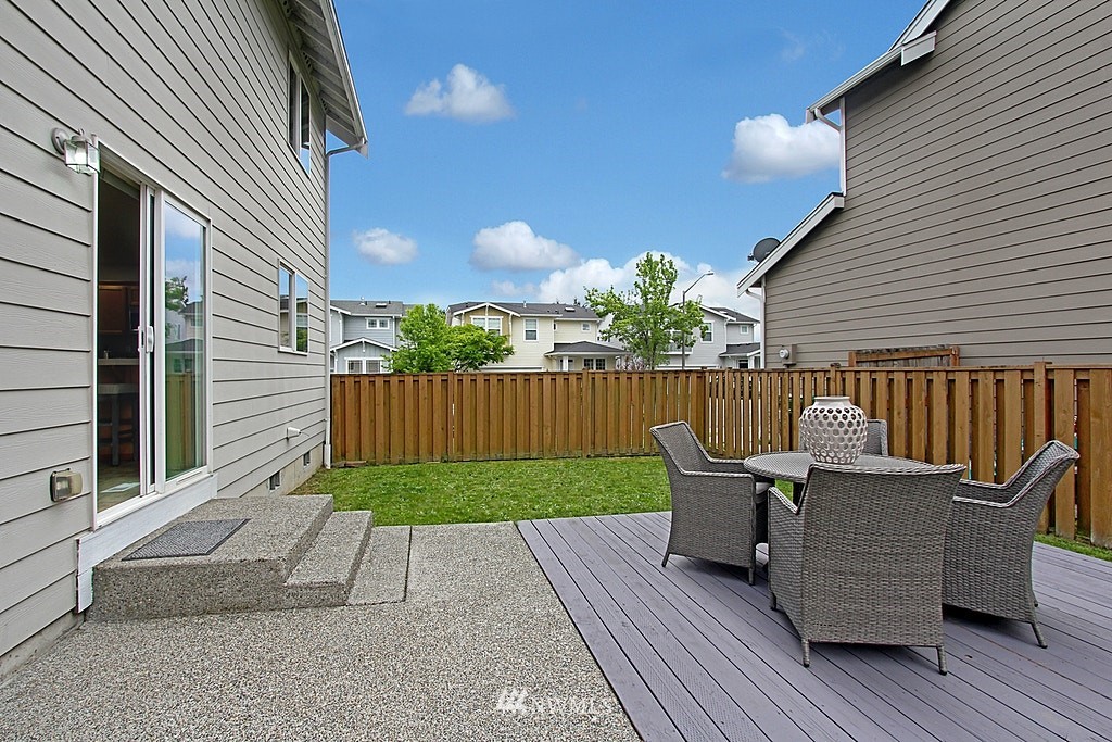 503 Ilwaco Avenue Northeast Renton, WA 98059 - Photo 1 of 17 a view of a patio with a table and chairs